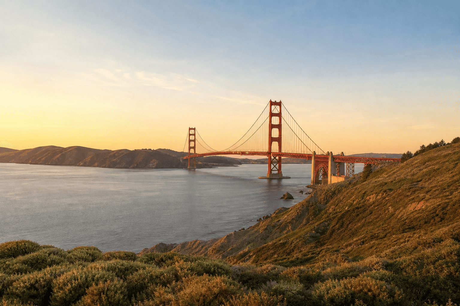 Golden Gate Bridge and San Francisco Bay at soft golden hour light